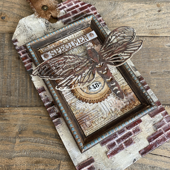 igirlzoe: tim holtz sizzix brickwork 3D embossing folder perspective moth switchlit seal